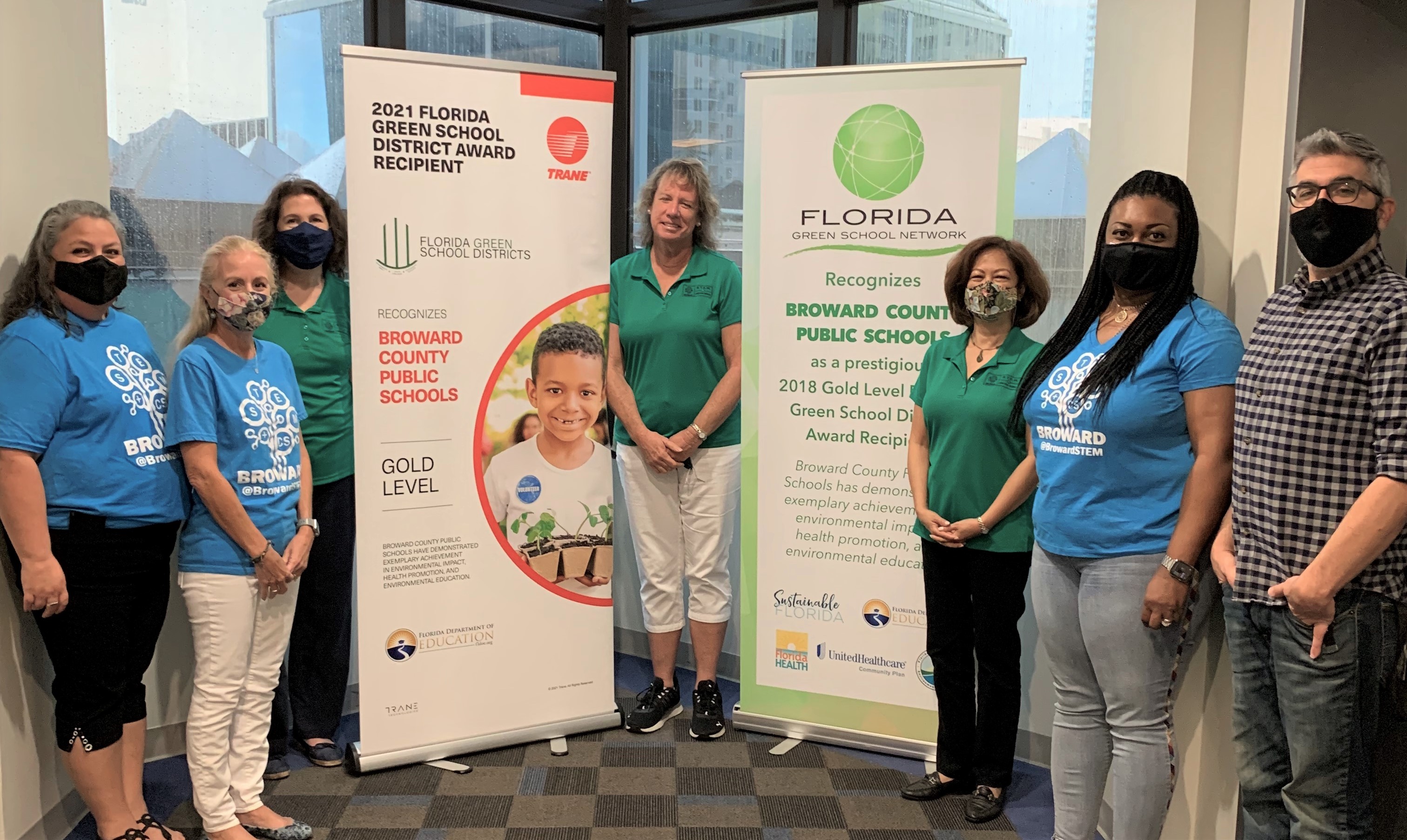STEM + CS staff with winning banner